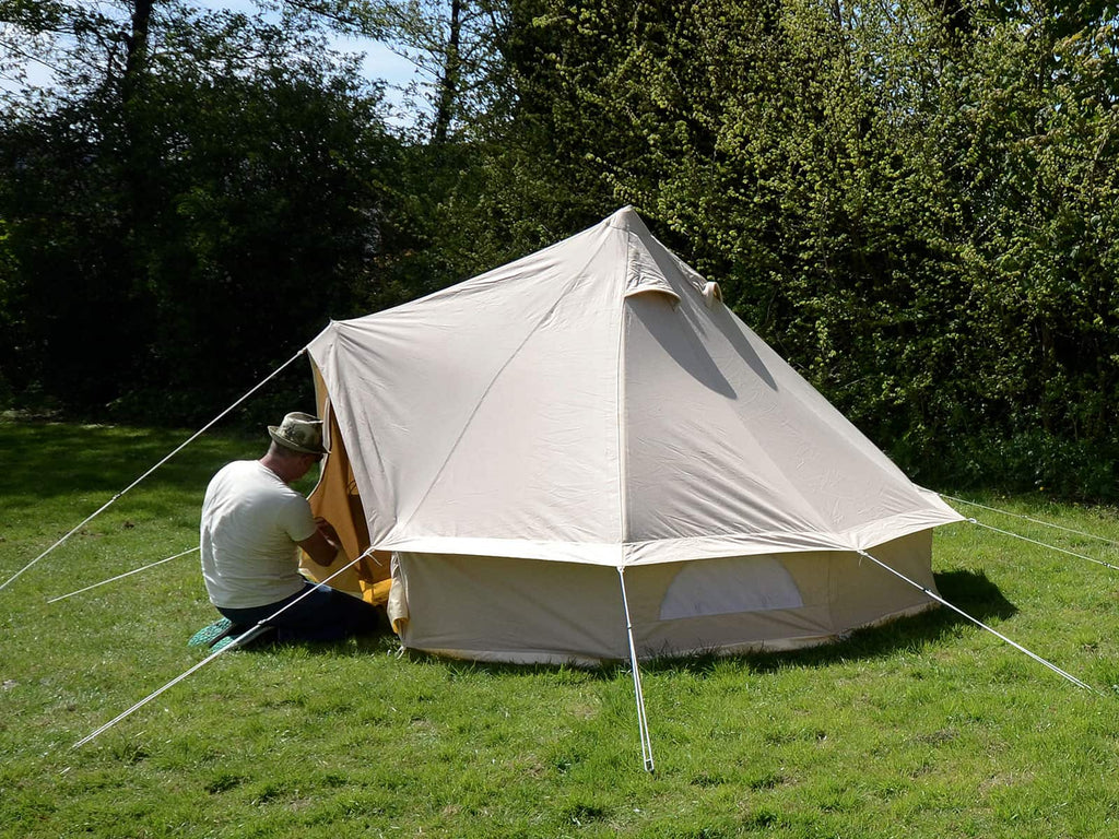Person knelt down at door of 3m standard bell tent