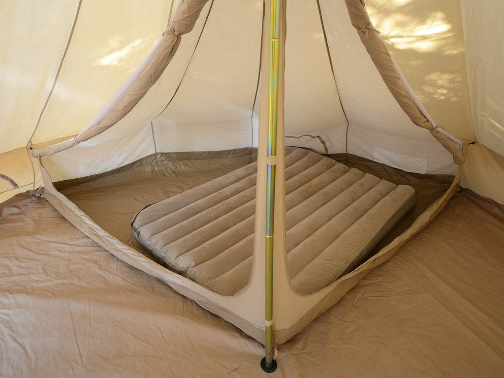 Double mattress inside a bell tent with 5m quarter sleeping compartment inner tent