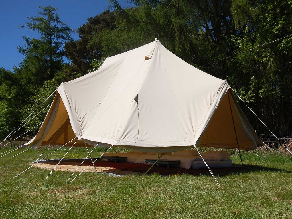 Pegged down groundsheet and walls rolled up on an emperor standard tent