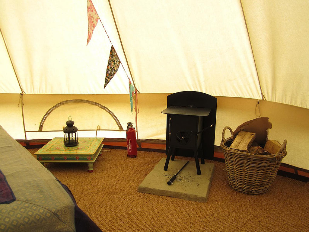 Bell Tent with low level Indian table next to bed