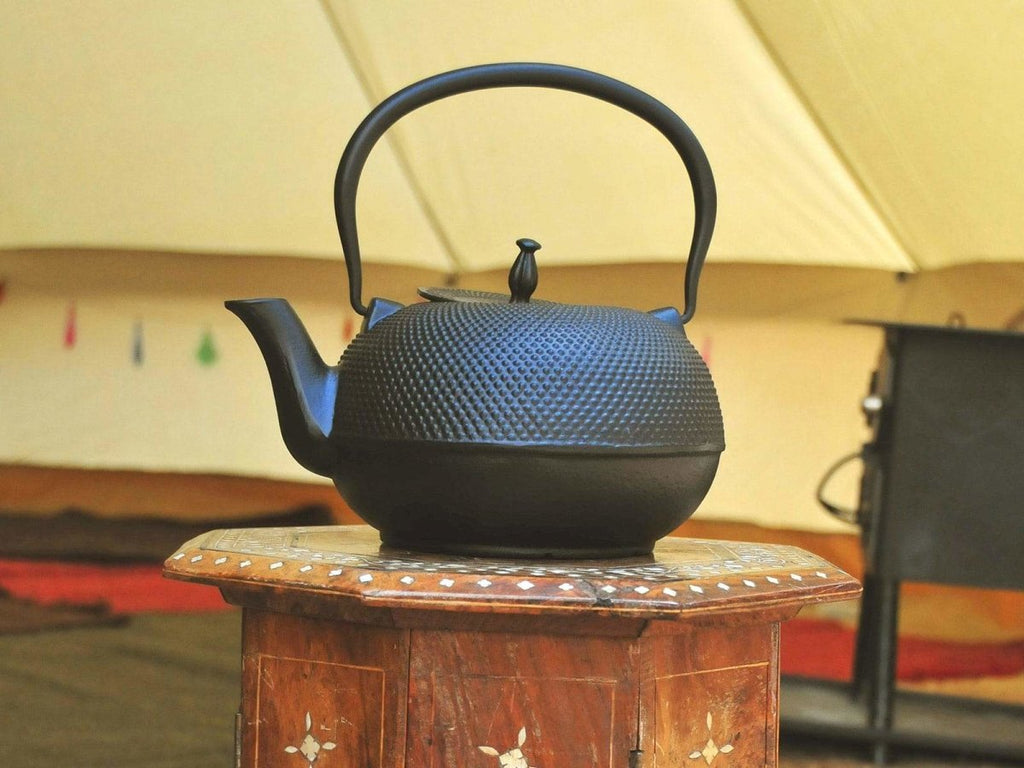 Premium cast iron tea kettle in a bell tent