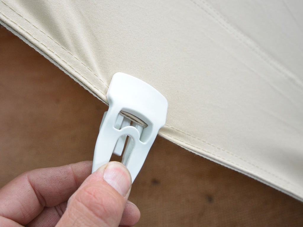 Magic clip fitted to bell tent canvas creating a new guy rope point
