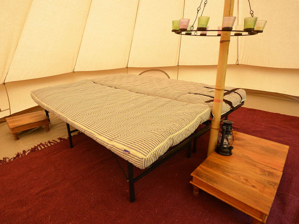 2x naturalmats on metal beds inside a bell tent