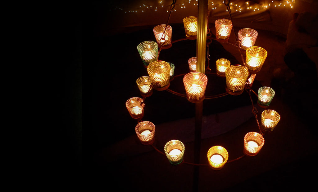 Camping lights for Glamping tents. Tea light chandeliers light and add warmth to a Bell Tent.