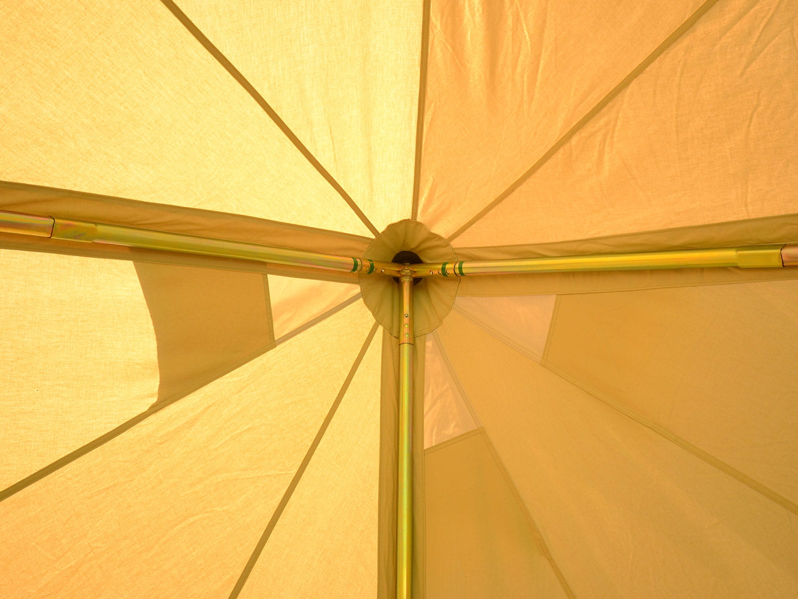Tripod pole crown and ceiling feature in a 3m standard bell tent.