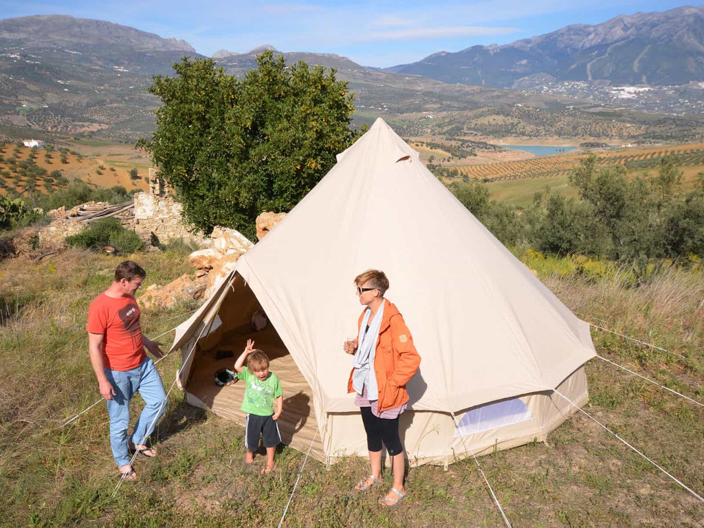 People standing in-front of a 4.5m ultimate bell tent