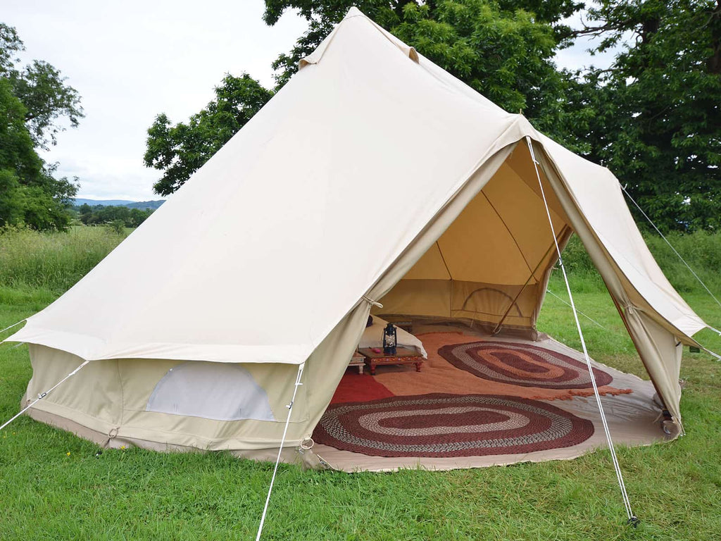 Outside a two door bell tent with doors open