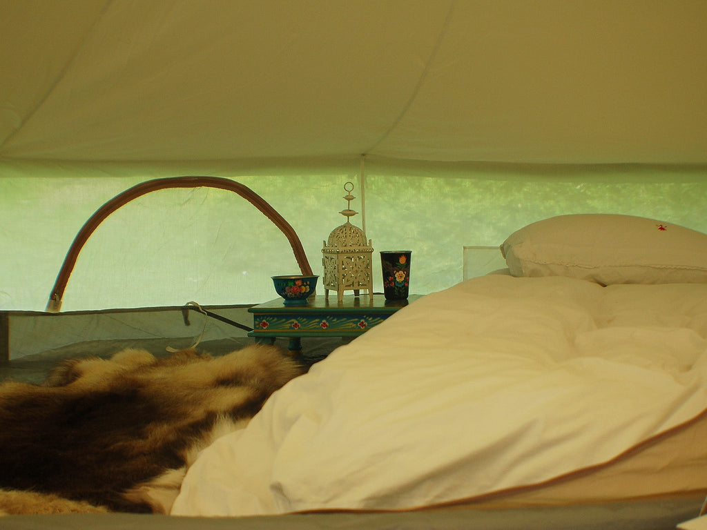 Inside an inner tent with the bell tent walls rolled up
