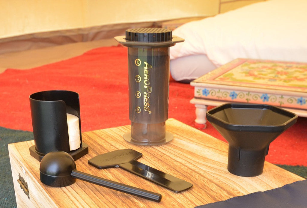 Aeropress portable coffee maker kit in a bell tent