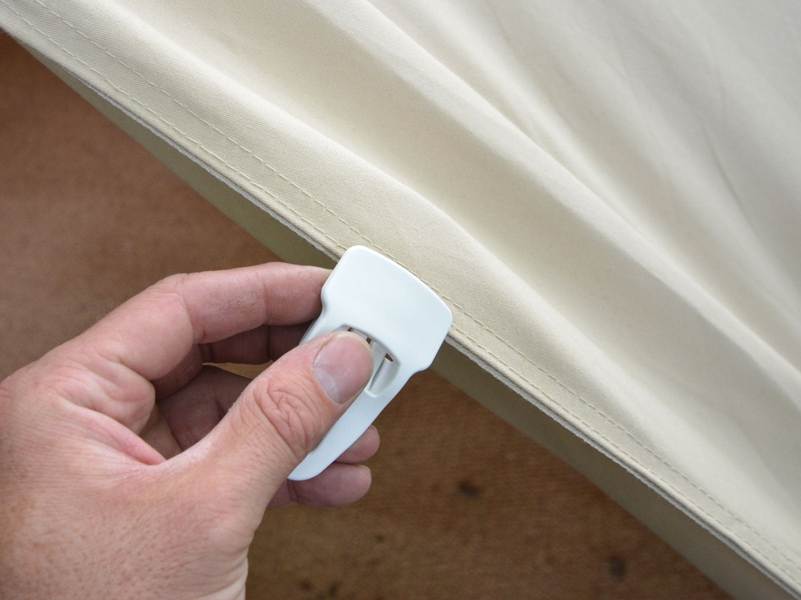 Attaching a magic clip to bell tent canvas