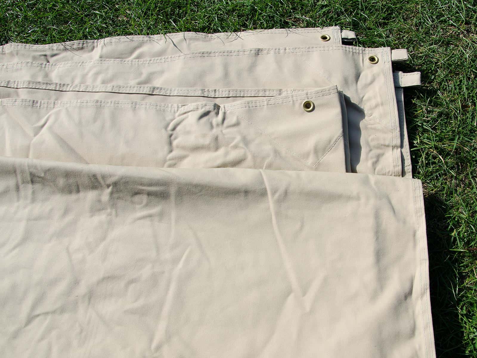 Eyelets and tabs for guy ropes and poles