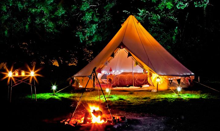 Fully furnished bell tent at night bell tent uk gift card