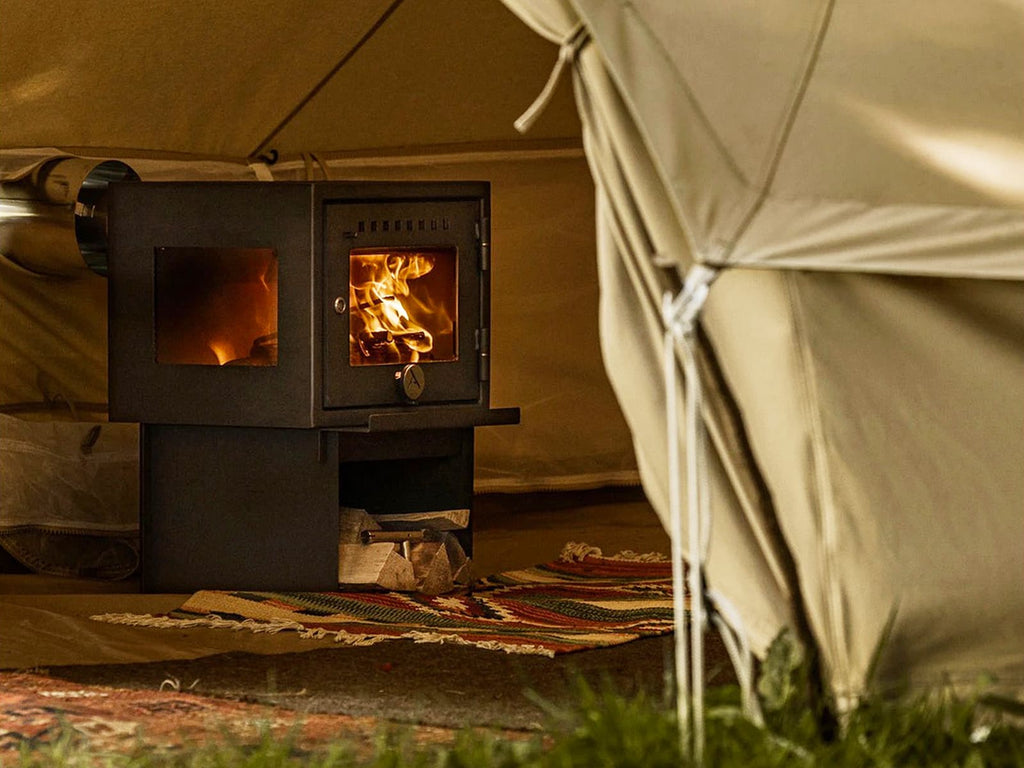 Fire burning inside and Orland Bell Tent Stove