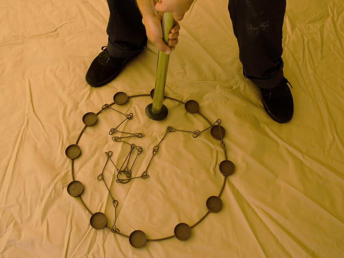 Installing a tea light chandelier to a bell tent centre pole