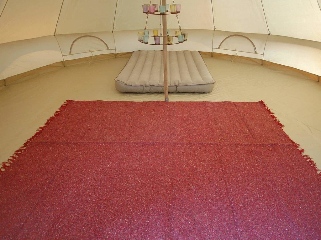 Bell tent with burgundy handloomed rug