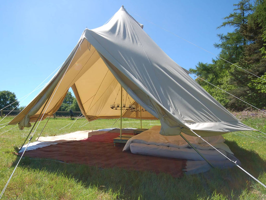 Side-view of 6m emperor bell tent with walls rolled up