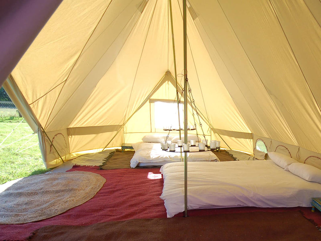Interior of 6m emperor bell tent with two double mattresses