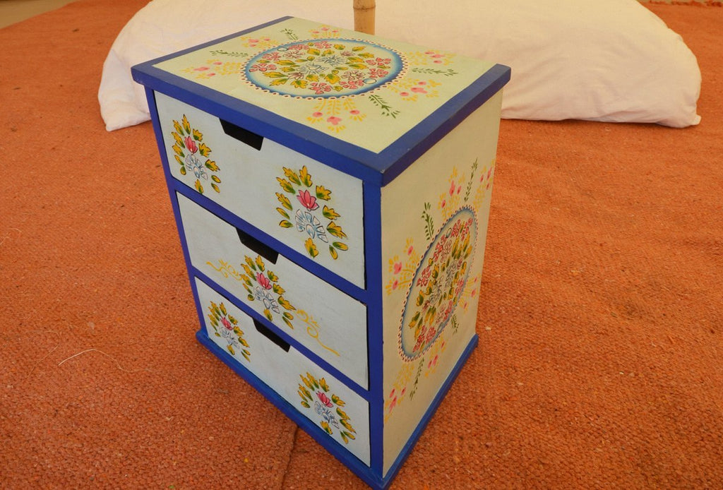 Blue and yellow camping with soul chest of indian drawers