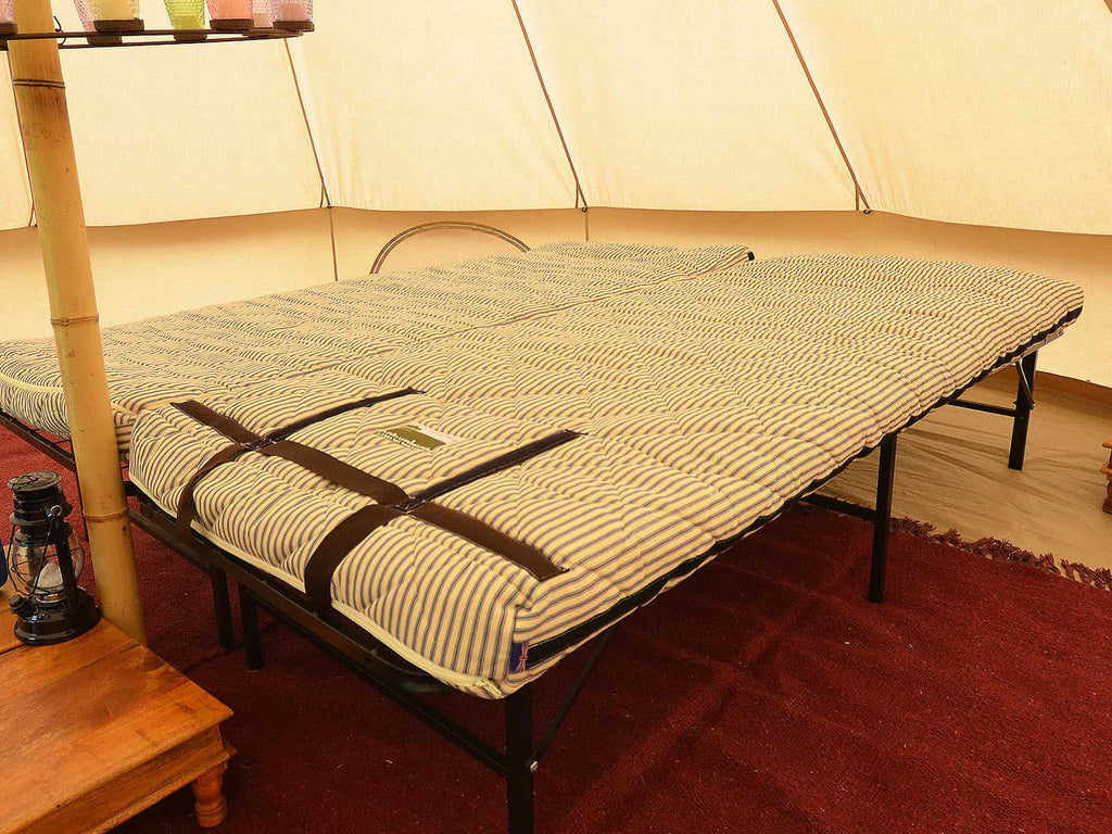 Two adult naturalmats as a double bed in a bell tent