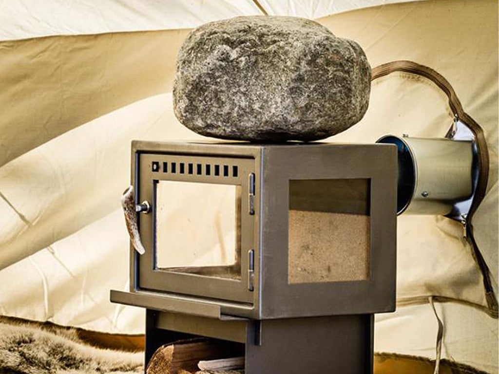 Heat a rock on the stove top of an Orland Tent Stove