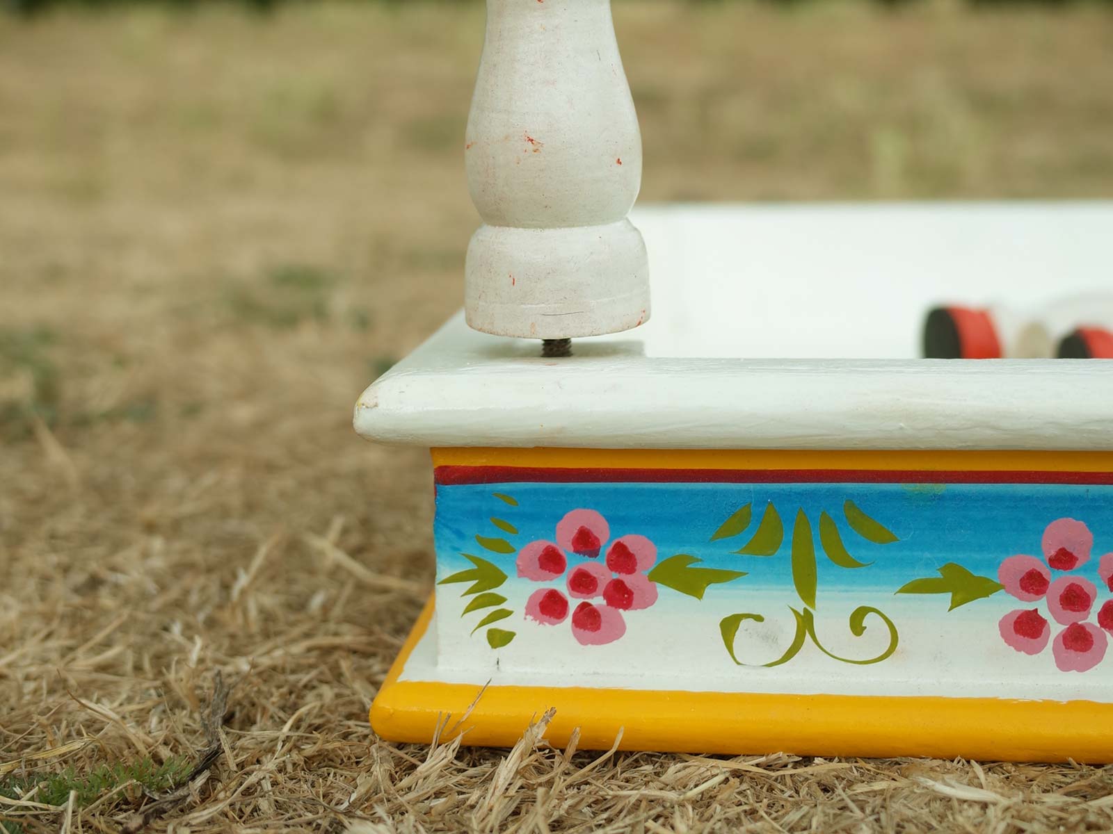 Screw in foot of low level square indian table - Aqua