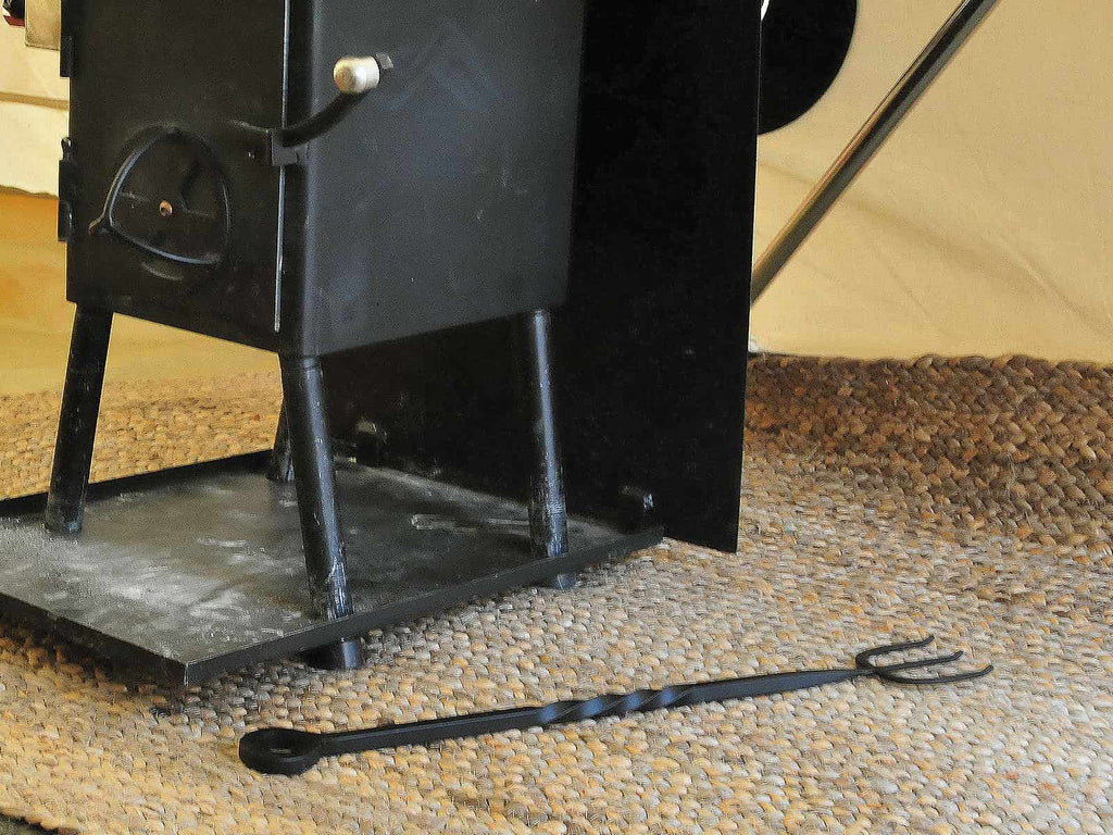 Bell tent stove and cast iron toasting for cooking utensil