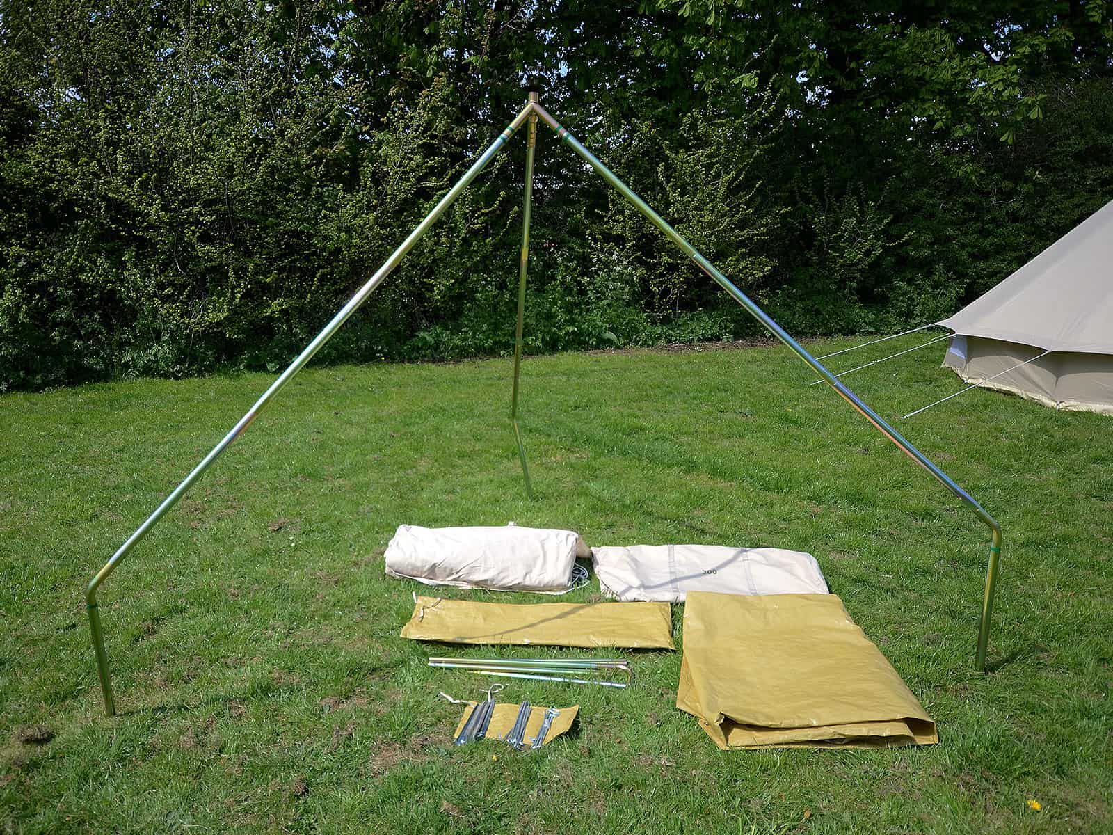 Features tripod pole system, groundsheet, canvas and pegs.